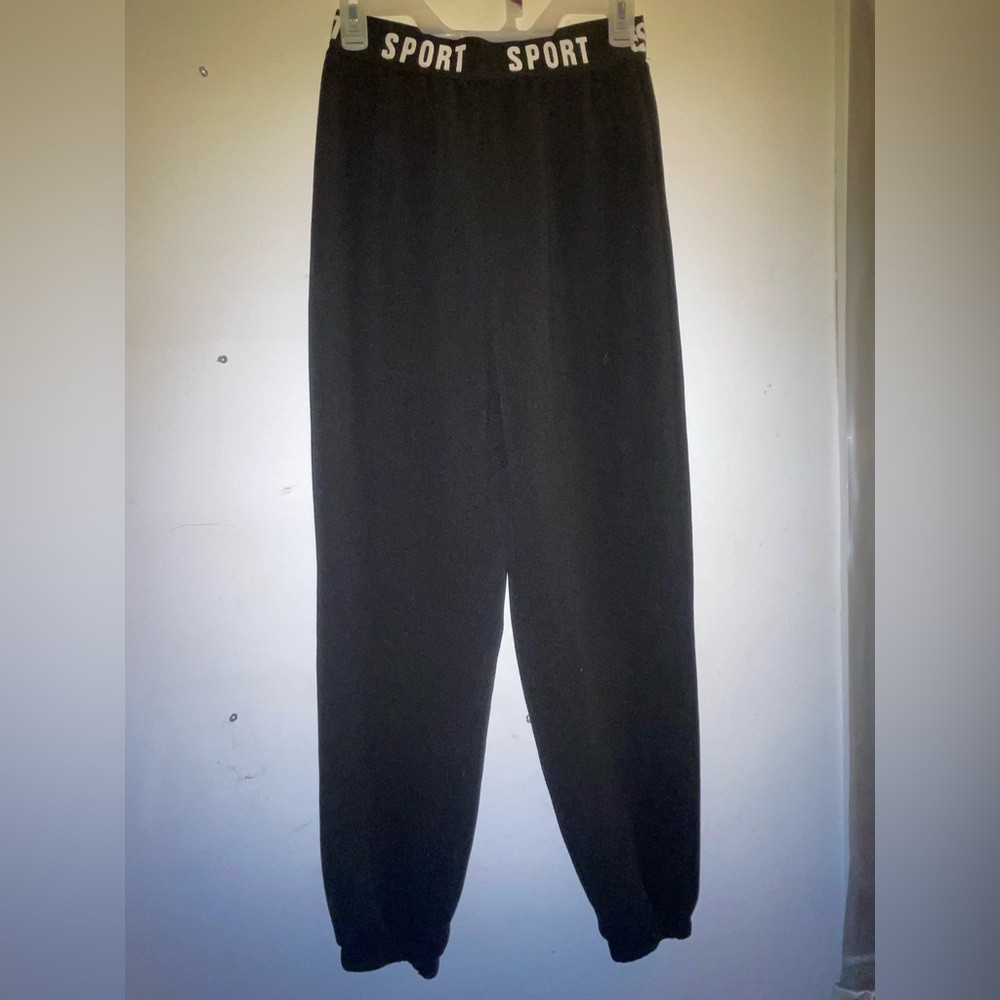 Black pants from SHEIN with “sport” on the waistband.